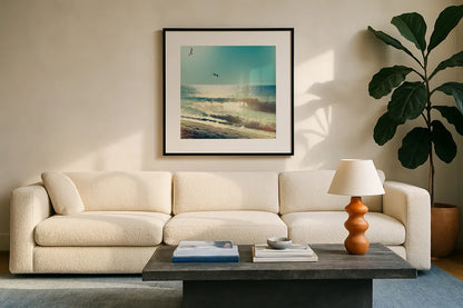Coastline Waves no Word by Sue Schlabach. Displayed in a glass frame with matte in a clean modern living room. Available as an archival giclee rolled canvas, fine art paper, or poster print. SKU 33117a.