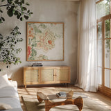 Cottage Roses IV by Sue Schlabach. Shown in a natural wood frame in a cozy modern living room. Available as an archival giclee rolled canvas, fine art paper, or poster print. SKU 31614a.