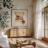 Cupcake Quartet by Sue Schlabach. Shown in a natural wood frame in a cozy modern living room. Available as an archival giclee rolled canvas, fine art paper, or poster print. SKU 9199a.