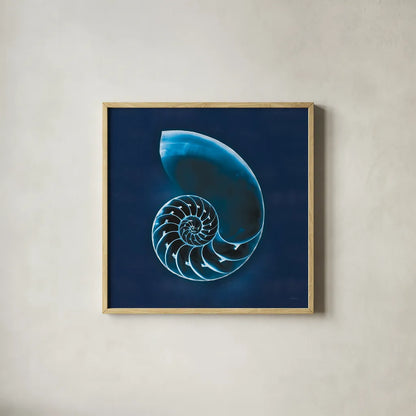 Cyanotype Sea II by Sue Schlabach. Shown in a natural wood glass frame for a timeless modern aesthetic. Available as an archival giclee rolled canvas, fine art paper, or poster print. SKU 32595a.