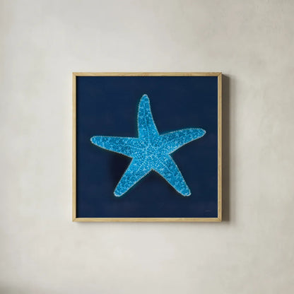 Cyanotype Sea III by Sue Schlabach. Shown in a natural wood glass frame for a timeless modern aesthetic. Available as an archival giclee rolled canvas, fine art paper, or poster print. SKU 32596a.