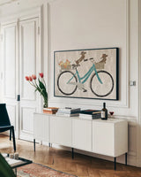 Doxie Ride ver I by Sue Schlabach. shown as a framed stretched canvas in a living room above a console. Available as a archival giclee rolled canvas, fine art paper, or poster print. SKU 22130i.