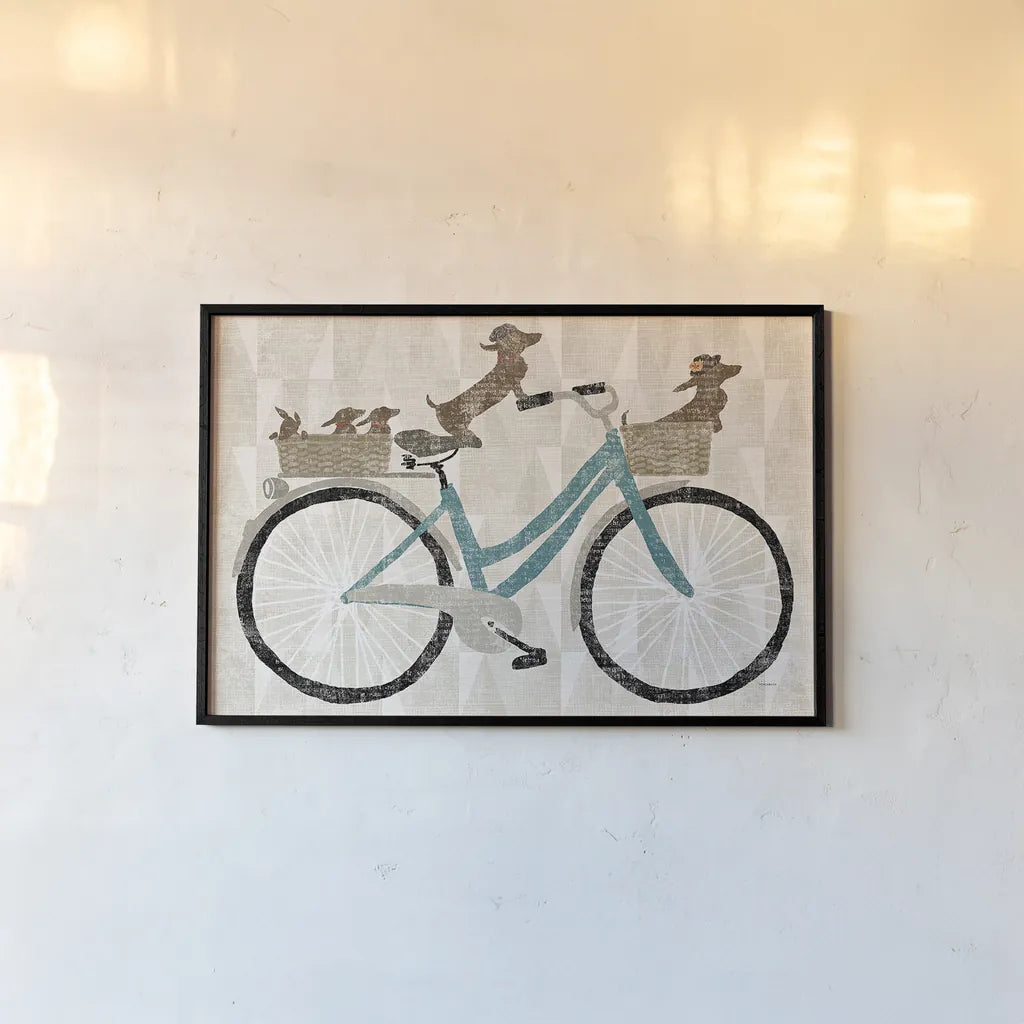 Doxie Ride ver II by Sue Schlabach. shown as a paper print in a black flame. Available as a archival giclee rolled canvas, fine art paper, or poster print. SKU 22131i.