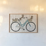 Doxie Ride ver II by Sue Schlabach. shown as a paper print in a natural frame. Available as a archival giclee rolled canvas, fine art paper, or poster print. SKU 22131i.