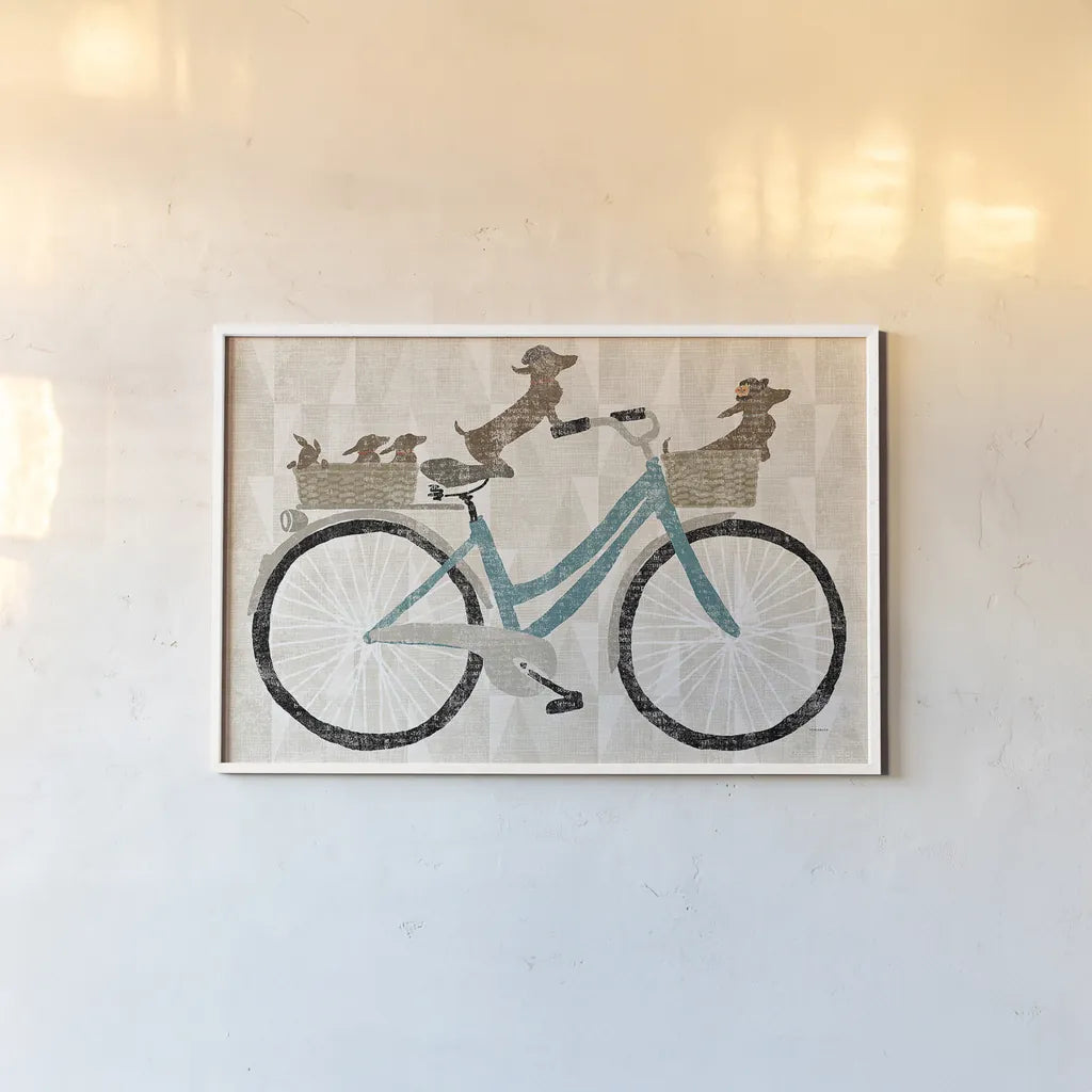 Doxie Ride ver II by Sue Schlabach. shown as a paper print in a white frame. Available as a archival giclee rolled canvas, fine art paper, or poster print. SKU 22131i.