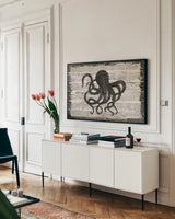 Driftwood Coast IV by Sue Schlabach. shown as a framed stretched canvas in a living room above a console. Available as a archival giclee rolled canvas, fine art paper, or poster print. SKU 48731i.