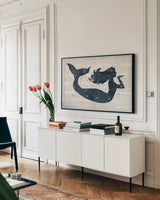 Driftwood Coast IX Blue by Sue Schlabach. shown as a framed stretched canvas in a living room above a console. Available as a archival giclee rolled canvas, fine art paper, or poster print. SKU 62606i.