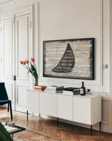 Driftwood Coast Scripture I by Sue Schlabach. shown as a framed stretched canvas in a living room above a console. Available as a archival giclee rolled canvas, fine art paper, or poster print. SKU 48732i.