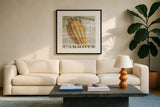 Farm Fresh Carrots by Sue Schlabach. Displayed in a glass frame with matte in a clean modern living room. Available as an archival giclee rolled canvas, fine art paper, or poster print. SKU 20840a.