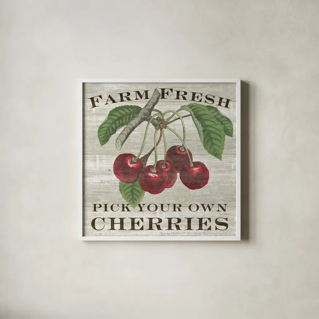 Farm Fresh Cherries Square by Sue Schlabach. Shown in a crisp white glass frame for a clean and minimalist style. Available as an archival giclee rolled canvas, fine art paper, or poster print. SKU 22659a.