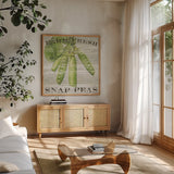 Farm Fresh Peas by Sue Schlabach. Shown in a natural wood frame in a cozy modern living room. Available as an archival giclee rolled canvas, fine art paper, or poster print. SKU 20841a.
