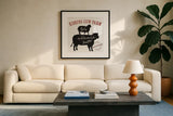 Farm Linen Cow Black by Sue Schlabach. Displayed in a glass frame with matte in a clean modern living room. Available as an archival giclee rolled canvas, fine art paper, or poster print. SKU 25093a.