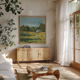 Farmhouse Across the Meadow by Sue Schlabach. Shown in a natural wood frame in a cozy modern living room. Available as an archival giclee rolled canvas, fine art paper, or poster print. SKU 82695a.