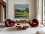 Farmhouse Across the Meadow by Sue Schlabach. Shown as extra-large giant wall art in a modern living room. Available as an archival giclee rolled canvas, fine art paper, or poster print. SKU 82695a.