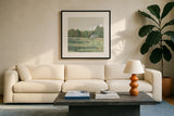 Farmhouse Across the Meadow Pastel by Sue Schlabach. Displayed in a glass frame with matte in a clean modern living room. Available as an archival giclee rolled canvas, fine art paper, or poster print. SKU 88117a.