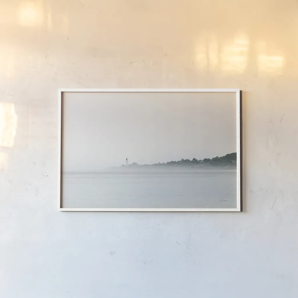 Foggy Lighthouse by Sue Schlabach. shown as a paper print in a white frame. Available as a archival giclee rolled canvas, fine art paper, or poster print. SKU 72426i.