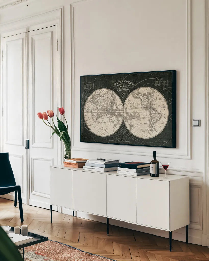 French World Map I Black and White by Sue Schlabach. shown as a framed stretched canvas in a living room above a console. Available as a archival giclee rolled canvas, fine art paper, or poster print. SKU 44666i.