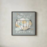Fresh Eggs III by Sue Schlabach. Shown in a sleek black glass frame for a contemporary gallery look. Available as an archival giclee rolled canvas, fine art paper, or poster print. SKU 31009a.