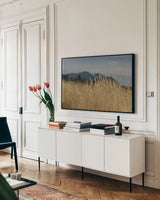 Golden Grasses II by Sue Schlabach. shown as a framed stretched canvas in a living room above a console. Available as a archival giclee rolled canvas, fine art paper, or poster print. SKU 82864i.