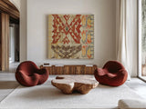 Grasslands Tapestry Red by Sue Schlabach. Shown as extra-large giant wall art in a modern living room. Available as an archival giclee rolled canvas, fine art paper, or poster print. SKU 44594a.