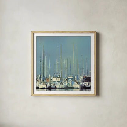 Harbor Boats Blue Sky by Sue Schlabach. Shown in a natural wood glass frame for a timeless modern aesthetic. Available as an archival giclee rolled canvas, fine art paper, or poster print. SKU 23865a.