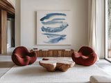 Indigo Waves by Sue Schlabach. Shown as extra-large giant wall art in a modern living room. Available as an archival giclee rolled canvas, fine art paper, or poster print. SKU 30246a.