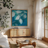 Ink Leaves I by Sue Schlabach. Shown in a natural wood frame in a cozy modern living room. Available as an archival giclee rolled canvas, fine art paper, or poster print. SKU 32439a.