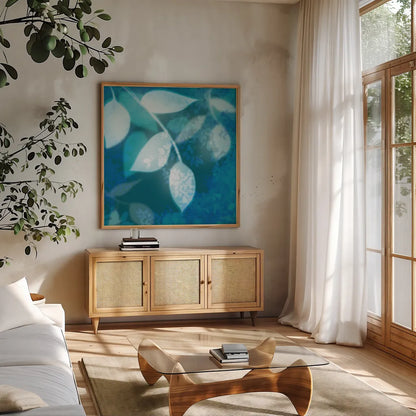 Ink Leaves I by Sue Schlabach. Shown in a natural wood frame in a cozy modern living room. Available as an archival giclee rolled canvas, fine art paper, or poster print. SKU 32439a.