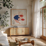 Island Findings IV Fish by Sue Schlabach. Shown in a natural wood frame in a cozy modern living room. Available as an archival giclee rolled canvas, fine art paper, or poster print. SKU 15101a.