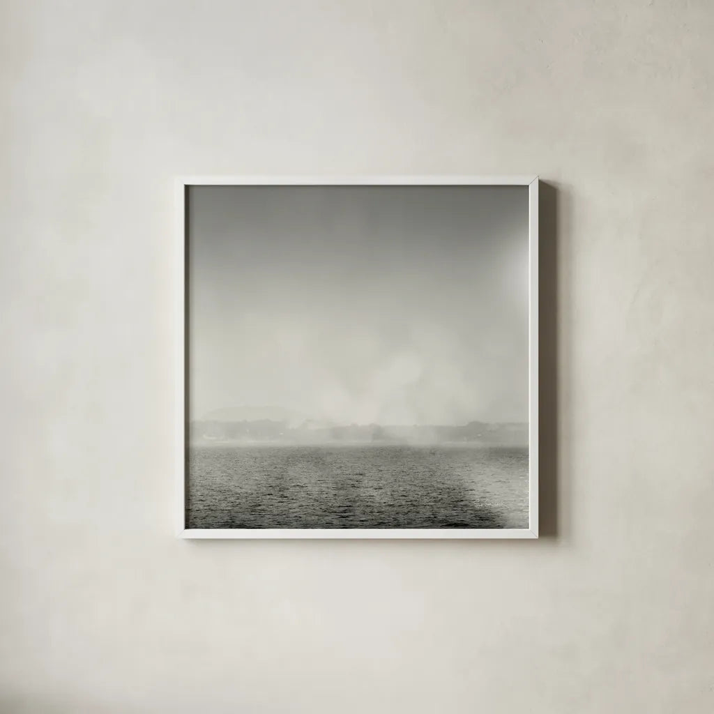 Lake Sail Square III by Sue Schlabach. Shown in a crisp white glass frame for a clean and minimalist style. Available as an archival giclee rolled canvas, fine art paper, or poster print. SKU 44567a.