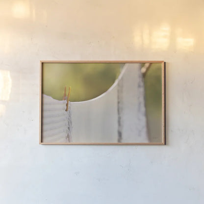 Laundry Day by Sue Schlabach. shown as a paper print in a natural frame. Available as a archival giclee rolled canvas, fine art paper, or poster print. SKU 34129i.