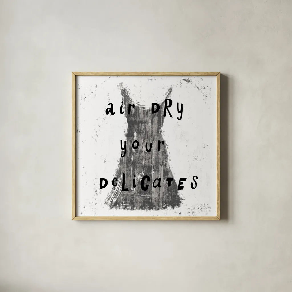 Laundry Rules VI BW by Sue Schlabach. Shown in a natural wood glass frame for a timeless modern aesthetic. Available as an archival giclee rolled canvas, fine art paper, or poster print. SKU 74234a.