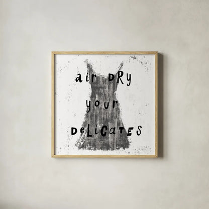 Laundry Rules VI BW by Sue Schlabach. Shown in a natural wood glass frame for a timeless modern aesthetic. Available as an archival giclee rolled canvas, fine art paper, or poster print. SKU 74234a.