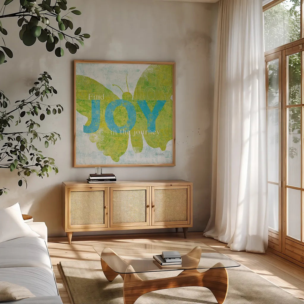 Letterpress Joy by Sue Schlabach. Shown in a natural wood frame in a cozy modern living room. Available as an archival giclee rolled canvas, fine art paper, or poster print. SKU 11376a.