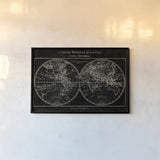 Map of the World Black by Sue Schlabach. shown as a paper print in a black flame. Available as a archival giclee rolled canvas, fine art paper, or poster print. SKU 46809i.