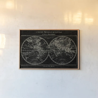 Map of the World Black by Sue Schlabach. shown as a paper print in a natural frame. Available as a archival giclee rolled canvas, fine art paper, or poster print. SKU 46809i.