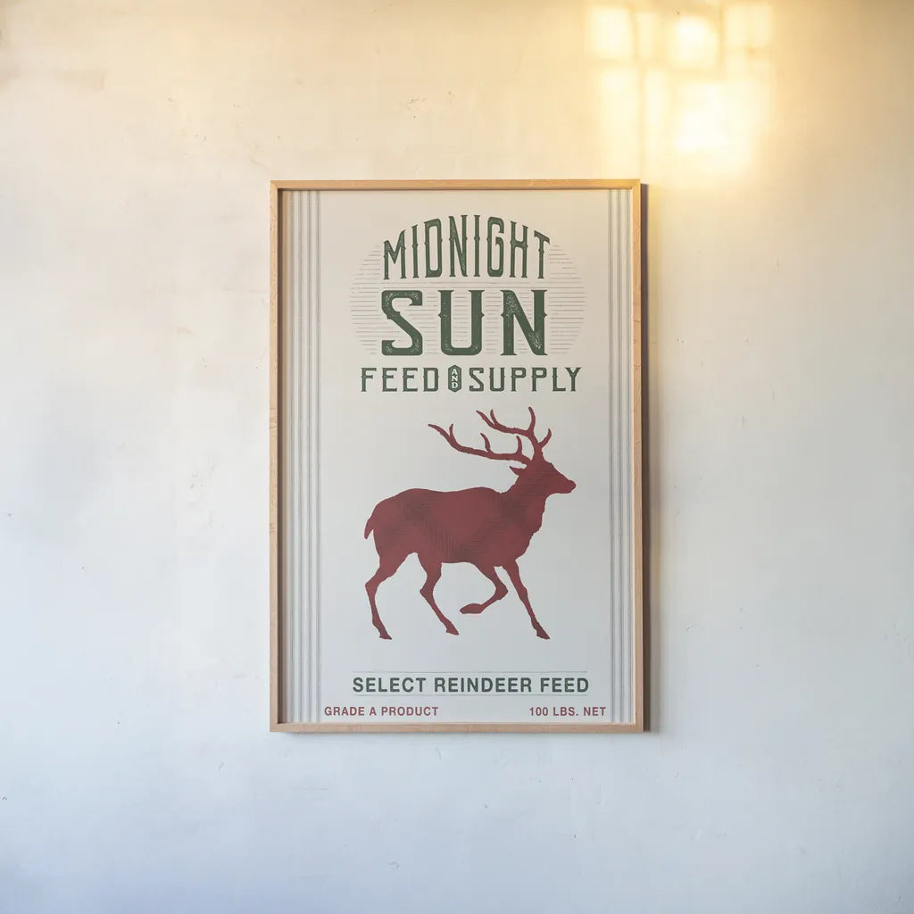Midnight Sun Reindeer Feed v2 by Sue Schlabach. shown as a paper print in a natural frame. Available as a archival giclee rolled canvas, fine art paper, or poster print. SKU 65048h.