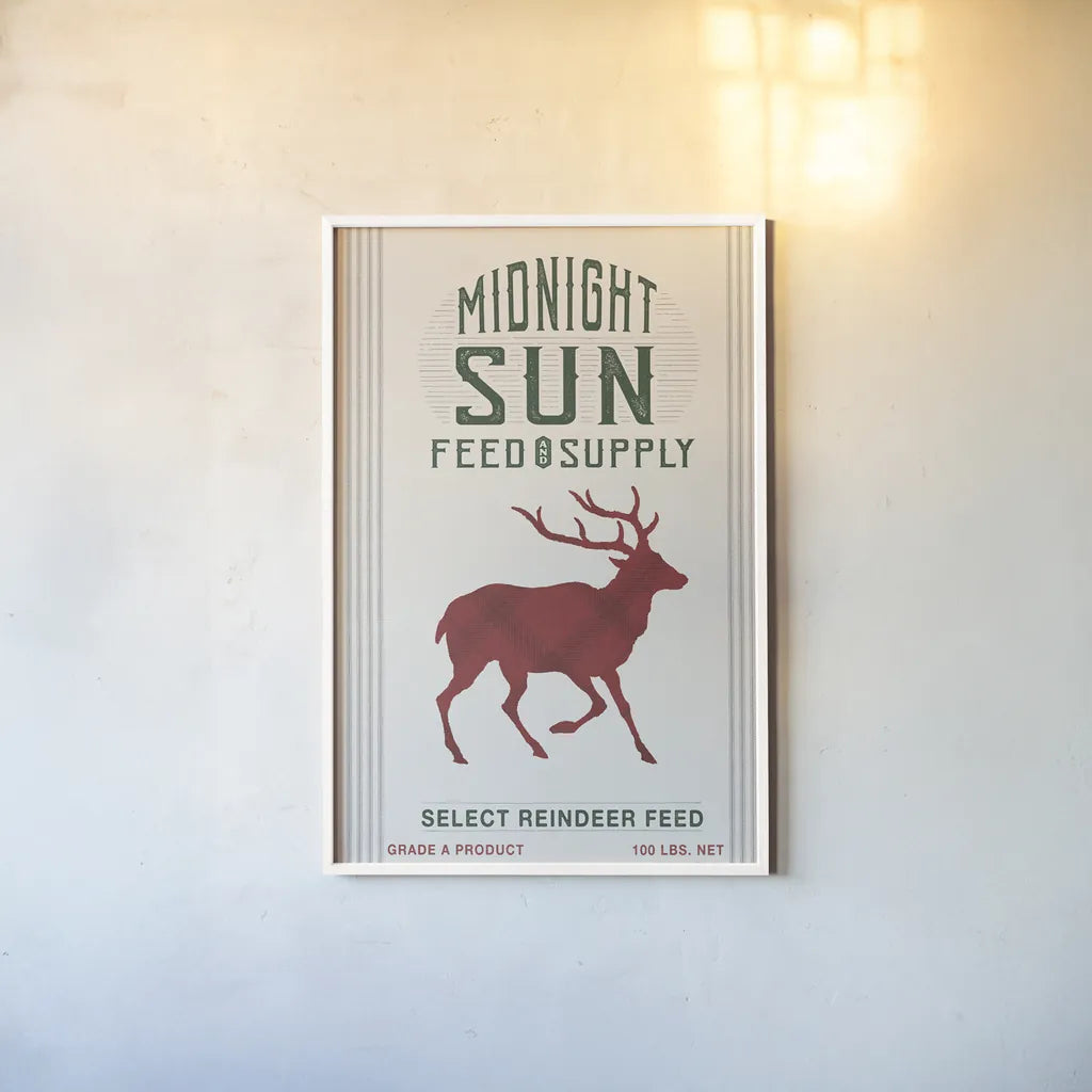 Midnight Sun Reindeer Feed v2 by Sue Schlabach. shown as a paper print in a white frame. Available as a archival giclee rolled canvas, fine art paper, or poster print. SKU 65048h.