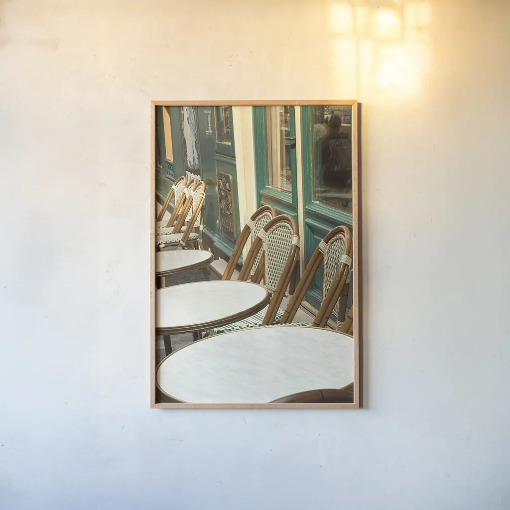 Montmartre Cafe by Sue Schlabach. shown as a paper print in a natural frame. Available as a archival giclee rolled canvas, fine art paper, or poster print. SKU 26499h.