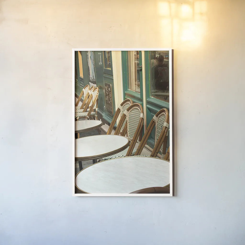 Montmartre Cafe by Sue Schlabach. shown as a paper print in a white frame. Available as a archival giclee rolled canvas, fine art paper, or poster print. SKU 26499h.