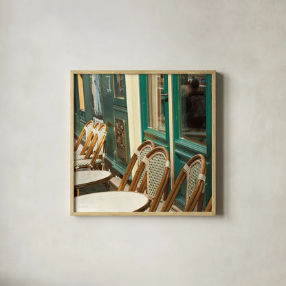 Montmartre Cafe Crop by Sue Schlabach. Shown in a natural wood glass frame for a timeless modern aesthetic. Available as an archival giclee rolled canvas, fine art paper, or poster print. SKU 26499a.