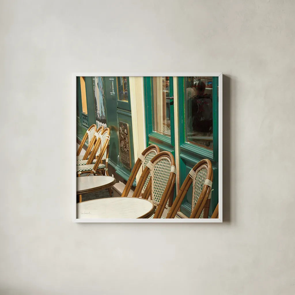 Montmartre Cafe Crop by Sue Schlabach. Shown in a crisp white glass frame for a clean and minimalist style. Available as an archival giclee rolled canvas, fine art paper, or poster print. SKU 26499a.