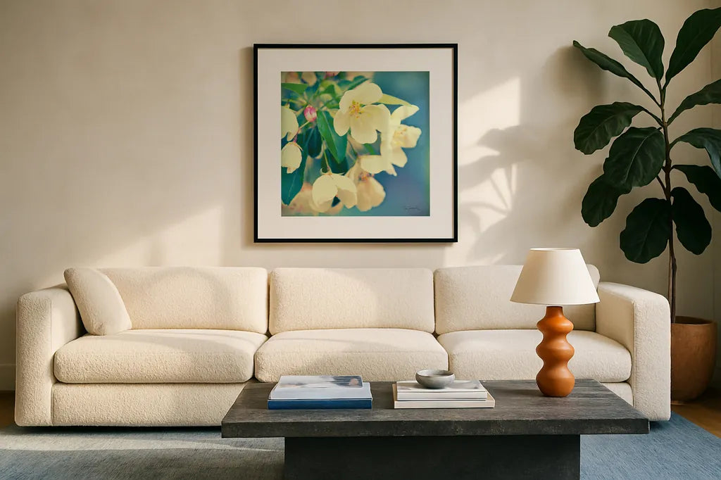 Natures Apple Blossom by Sue Schlabach. Displayed in a glass frame with matte in a clean modern living room. Available as an archival giclee rolled canvas, fine art paper, or poster print. SKU 10347a.
