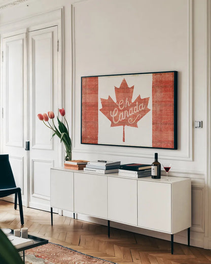 Oh Canada Flag by Sue Schlabach. shown as a framed stretched canvas in a living room above a console. Available as a archival giclee rolled canvas, fine art paper, or poster print. SKU 30820i.