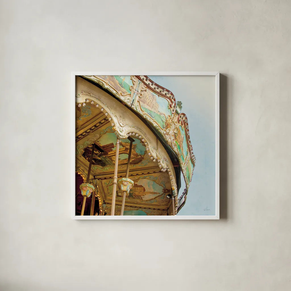 Paris Carousel I Aged by Sue Schlabach. Shown in a crisp white glass frame for a clean and minimalist style. Available as an archival giclee rolled canvas, fine art paper, or poster print. SKU 34160a.