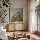 Paris Carousel II Aged by Sue Schlabach. Shown in a natural wood frame in a cozy modern living room. Available as an archival giclee rolled canvas, fine art paper, or poster print. SKU 34161a.