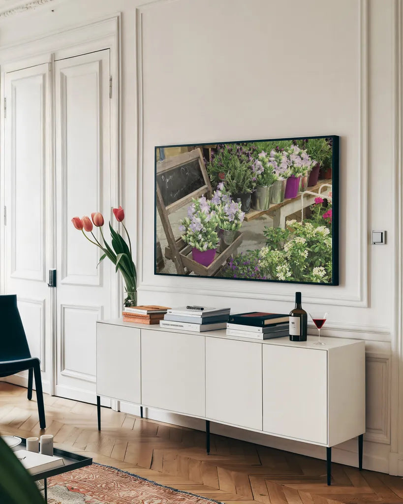 Paris Flower Market by Sue Schlabach. shown as a framed stretched canvas in a living room above a console. Available as a archival giclee rolled canvas, fine art paper, or poster print. SKU 34133i.