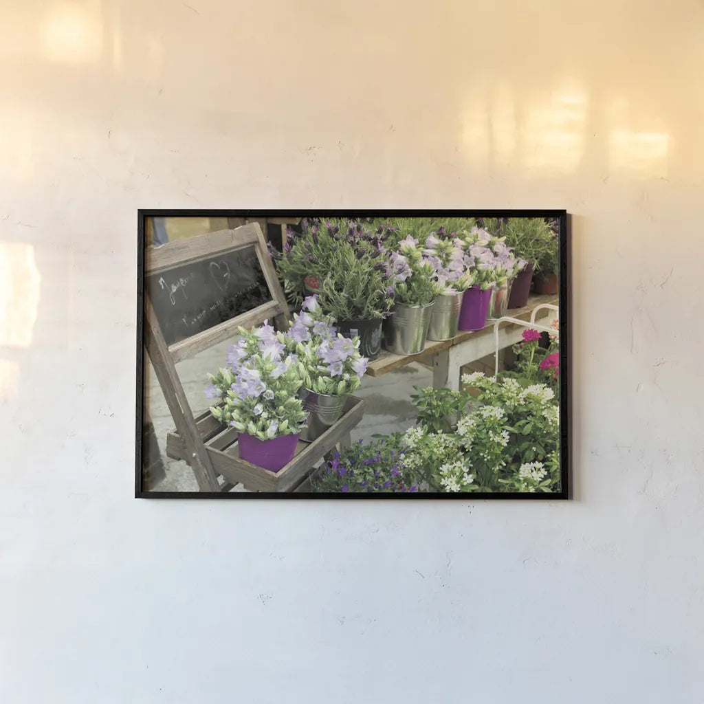 Paris Flower Market by Sue Schlabach. shown as a paper print in a black flame. Available as a archival giclee rolled canvas, fine art paper, or poster print. SKU 34133i.