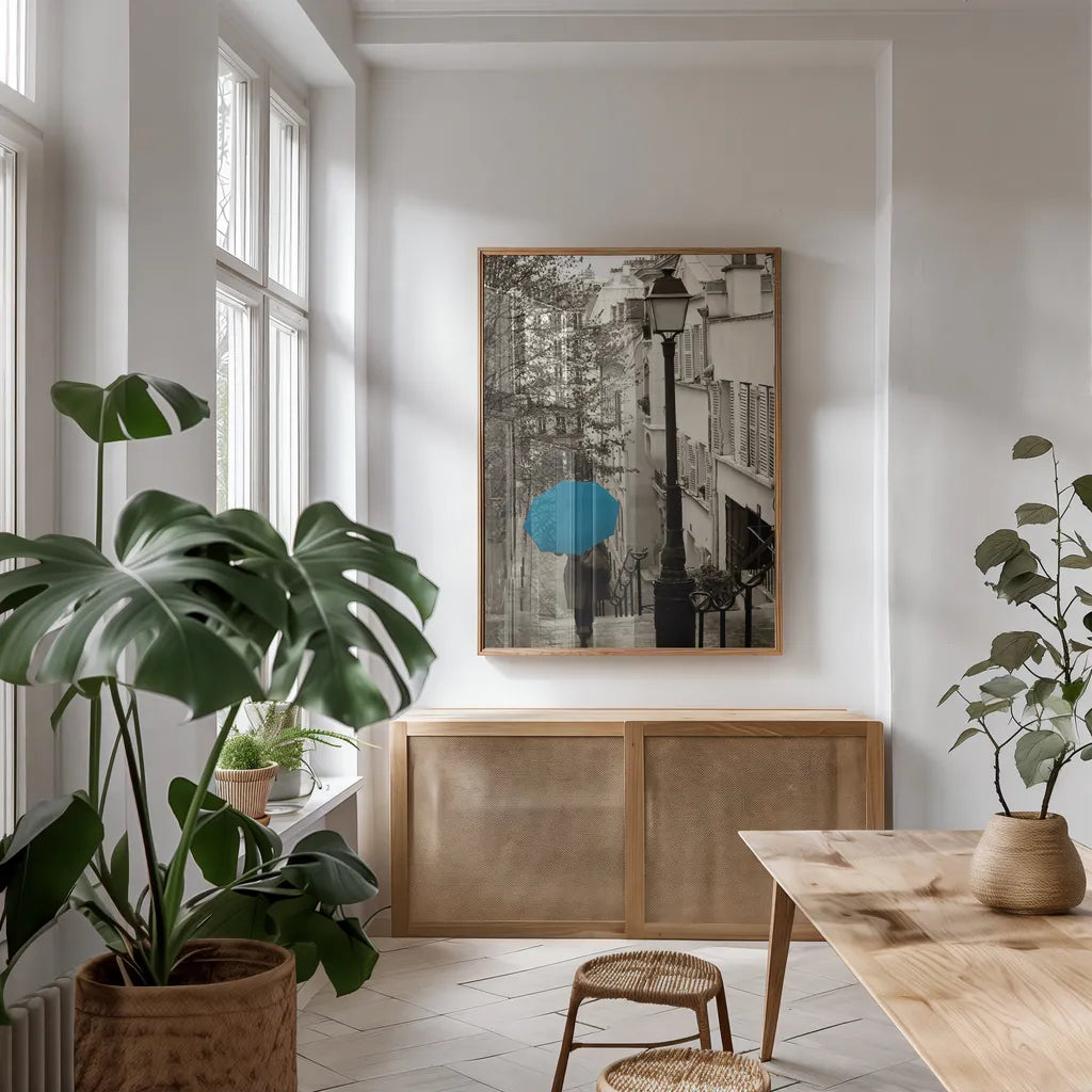 Paris Stroll II Teal Umbrella by Sue Schlabach. shown as a print in a natural wood frame in a dining room. Available as a archival giclee rolled canvas, fine art paper, or poster print. SKU 44745h.
