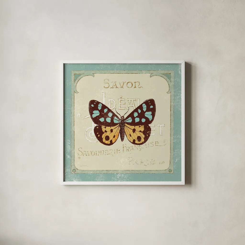 Parisian Butterfly I by Sue Schlabach. Shown in a crisp white glass frame for a clean and minimalist style. Available as an archival giclee rolled canvas, fine art paper, or poster print. SKU 9077a.